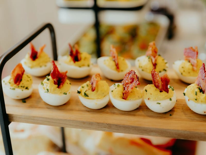 Sriracha Deviled Eggs With Candied Bacon — Snack, 173 kcal, 6g protein
